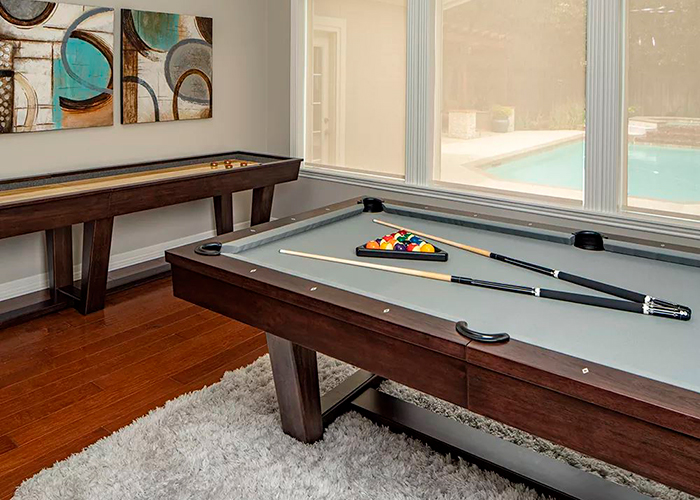 Wooden black pool table in a room